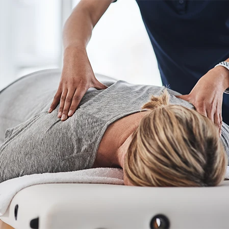 Woman Receiving Chiropractic Adjustment