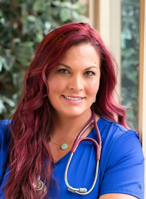 Chiropractor Shannon Hurley In Blue Scrubs Smiling