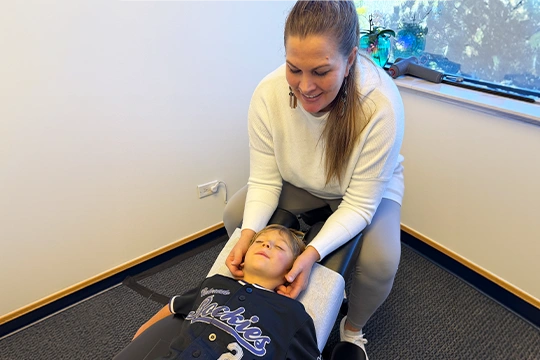 Chiropractor Shannon Hurley With A Pediatric Patient